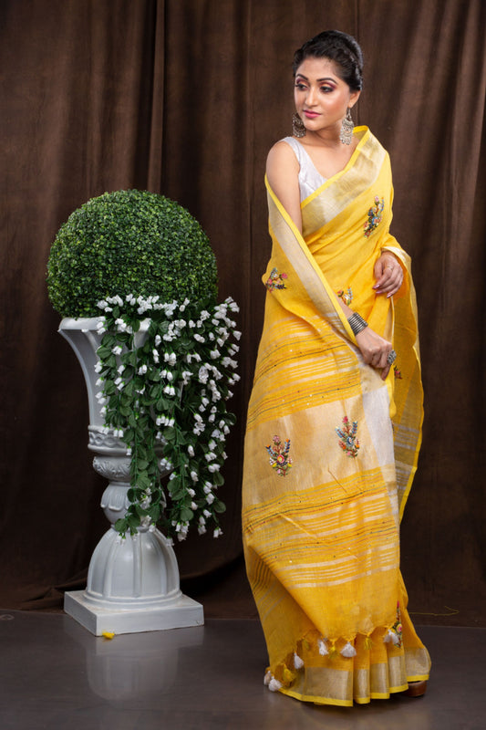Linen hand embroiderd yellow zari saree