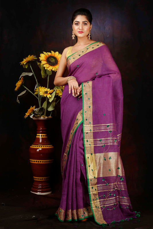 Linen hand embroidered purple zari saree