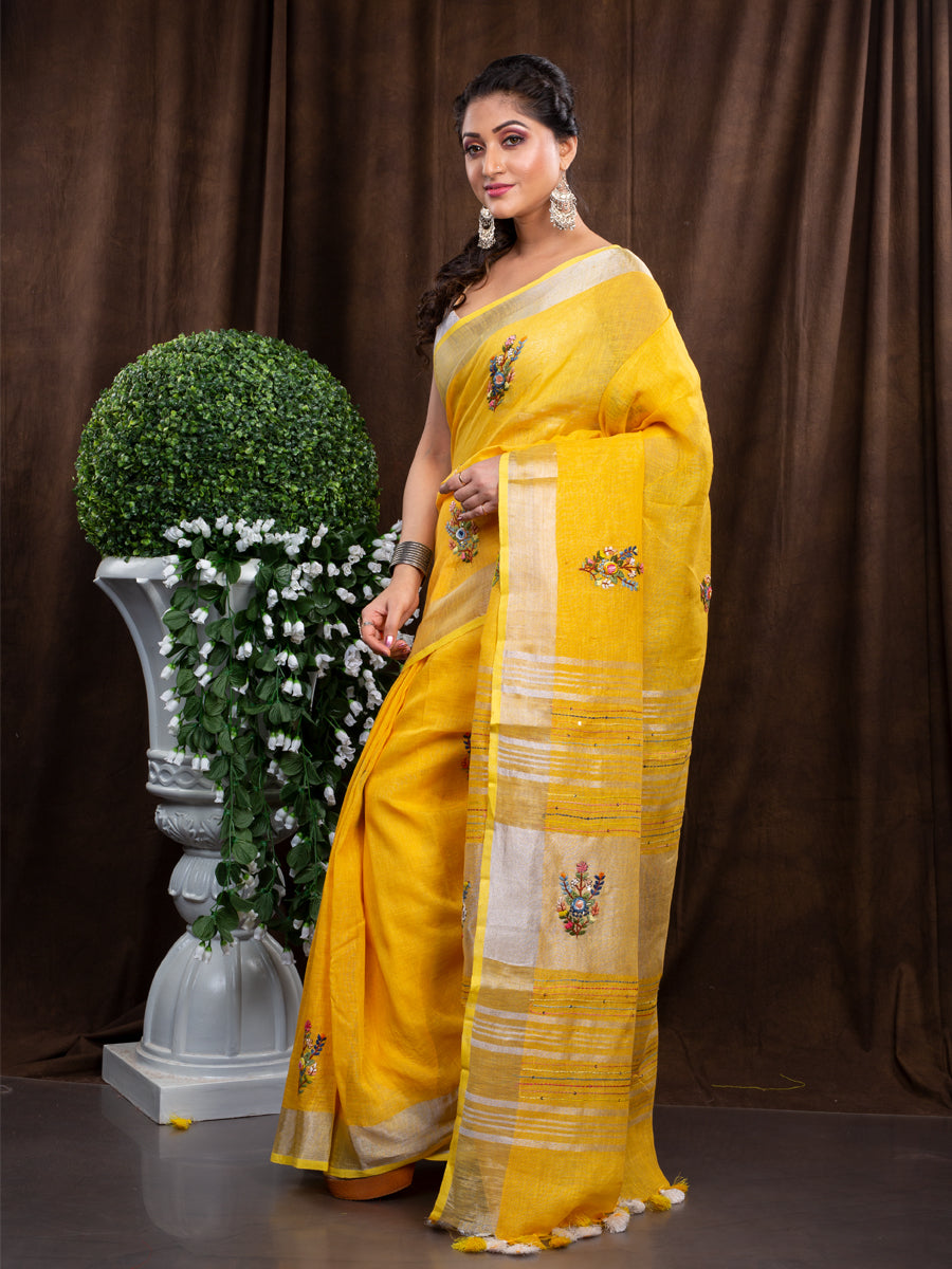 Linen hand embroiderd yellow zari saree