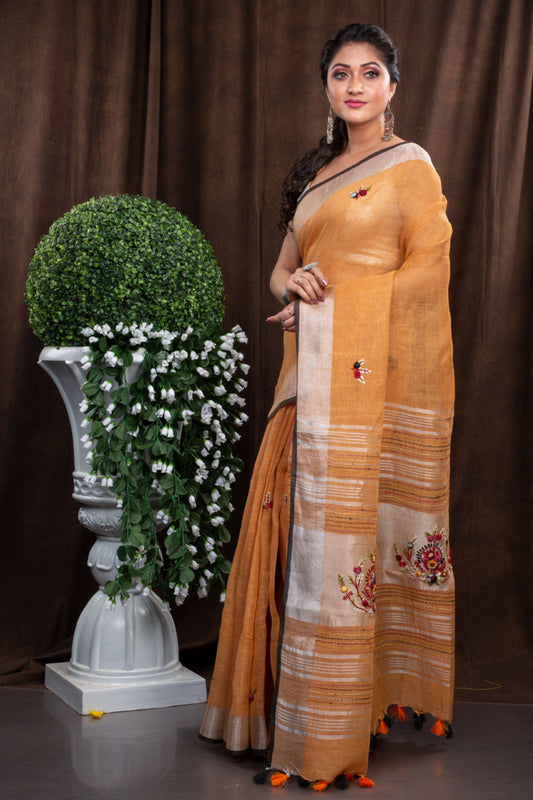 Linen Hand embroiderd light orange zari saree