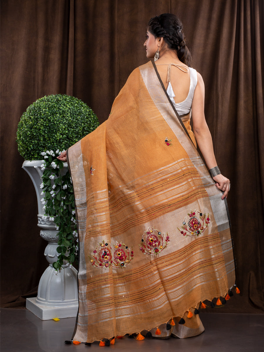 Linen Hand embroiderd light orange zari saree