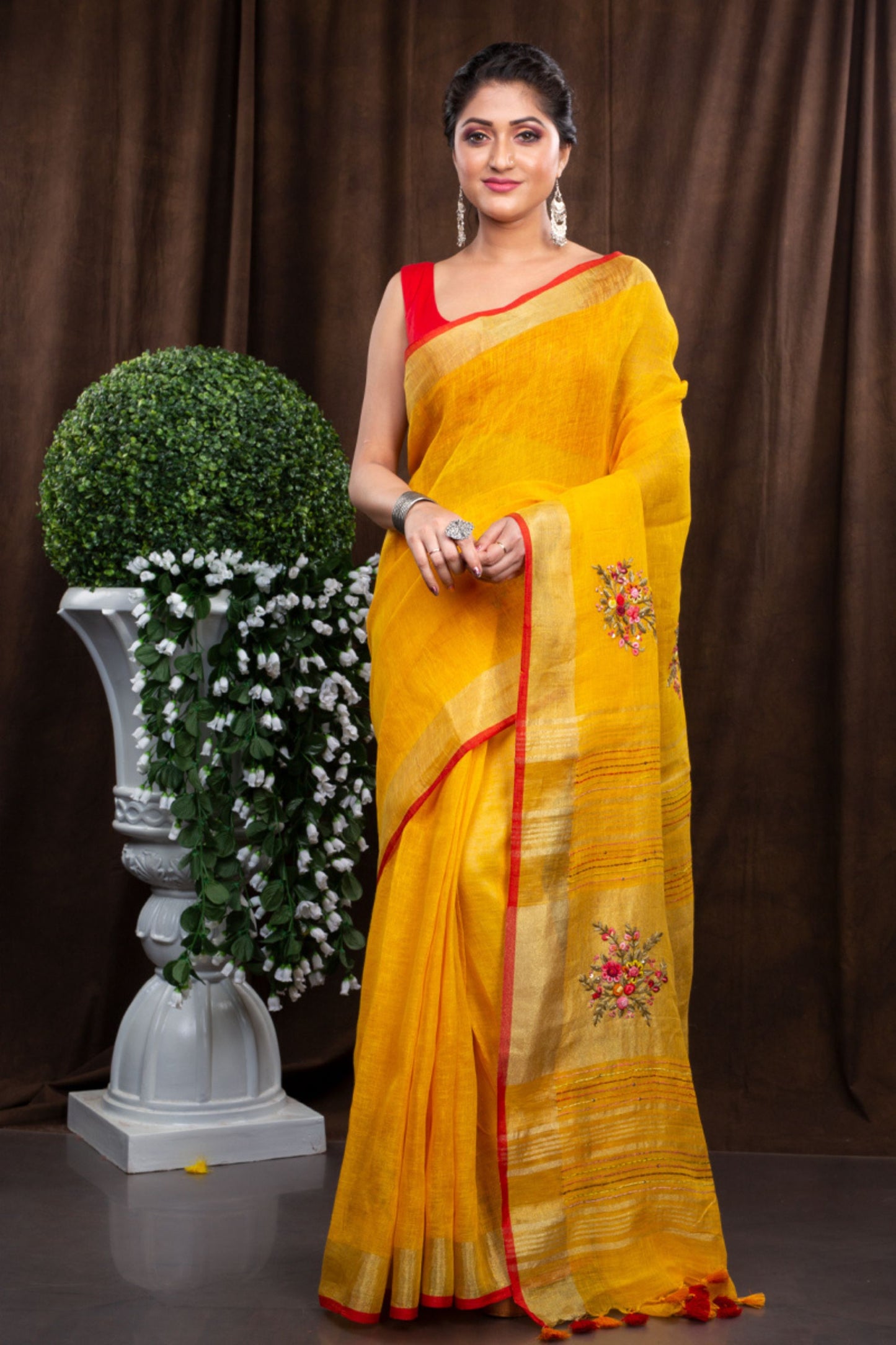 Linen hand embroidered zari yellow saree