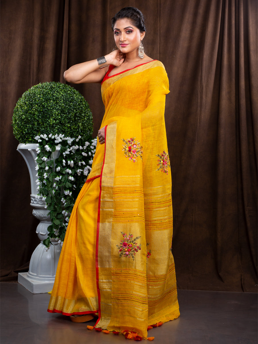 Linen hand embroidered zari yellow saree