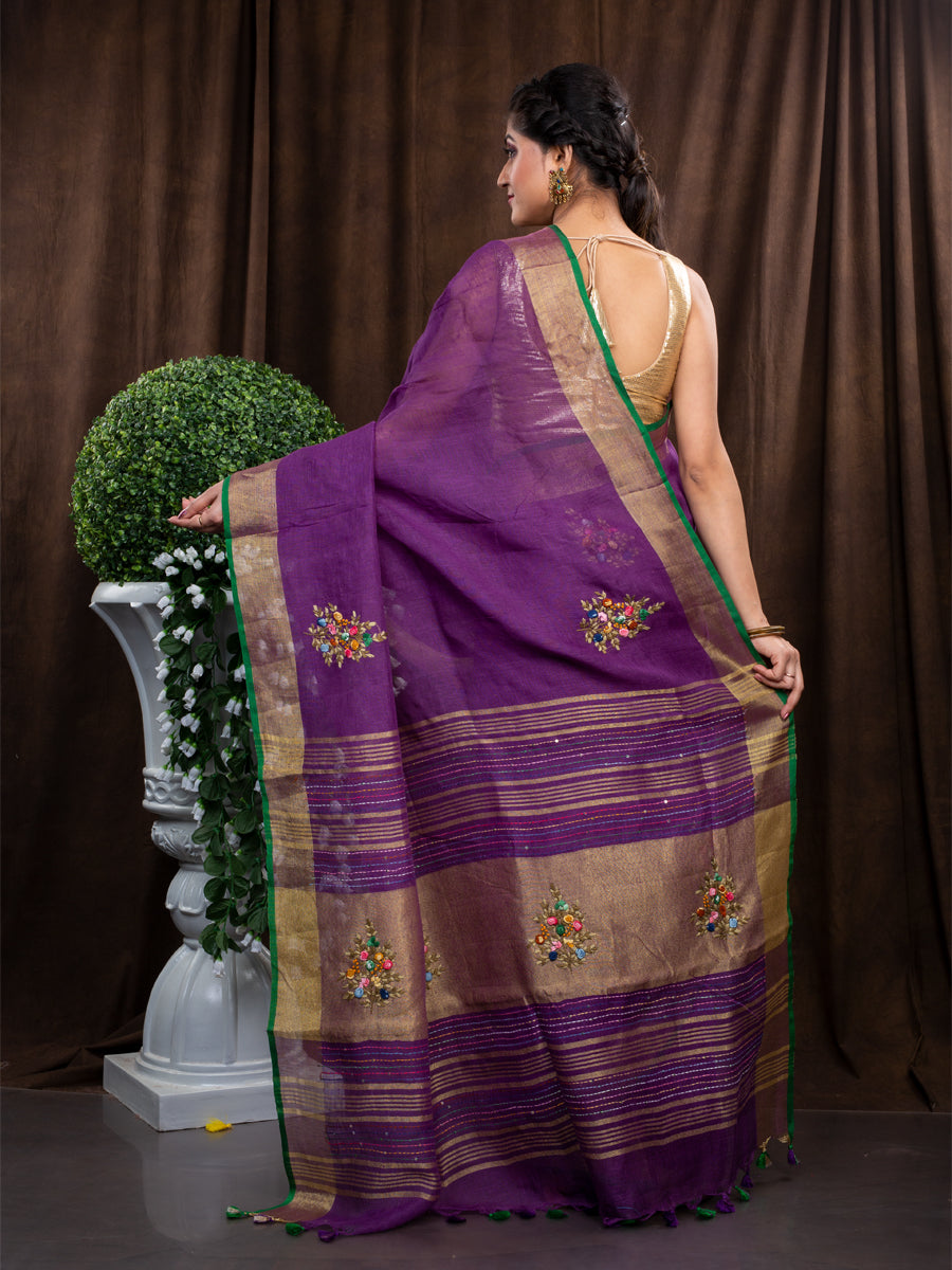 Linen hand embroidered zari purple saree