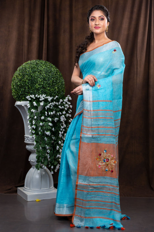 Linen hand embroidered light blue zari saree