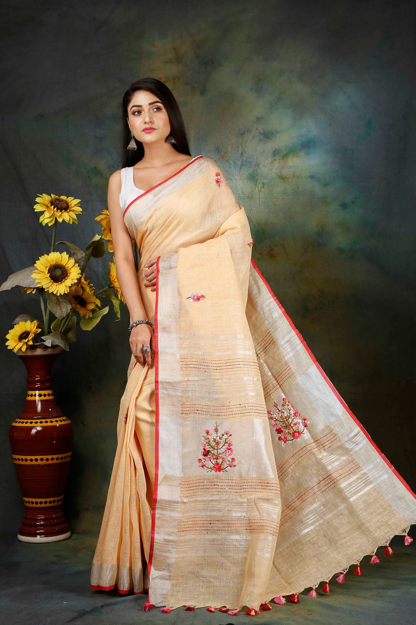 Linen Hand embroidered peach zari saree