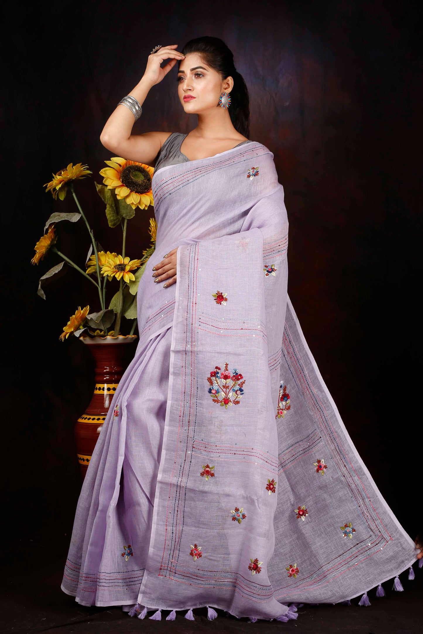 Linen hand embroidered zari saree