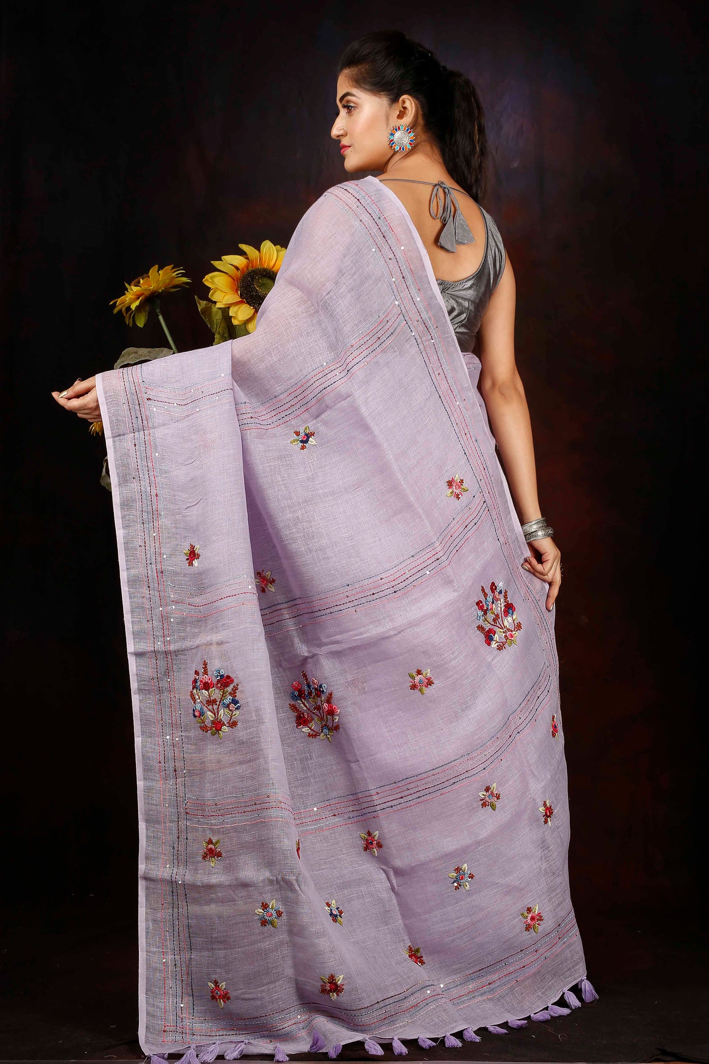 Linen hand embroidered zari saree