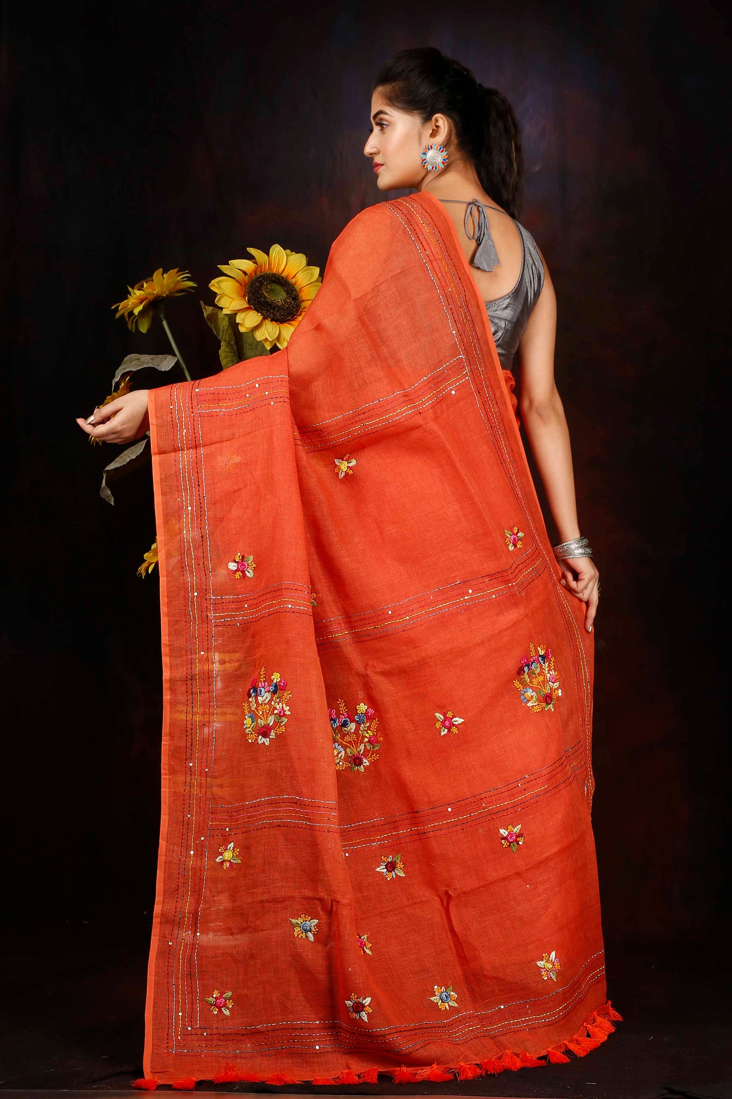 Linen hand embroidered zari orange saree
